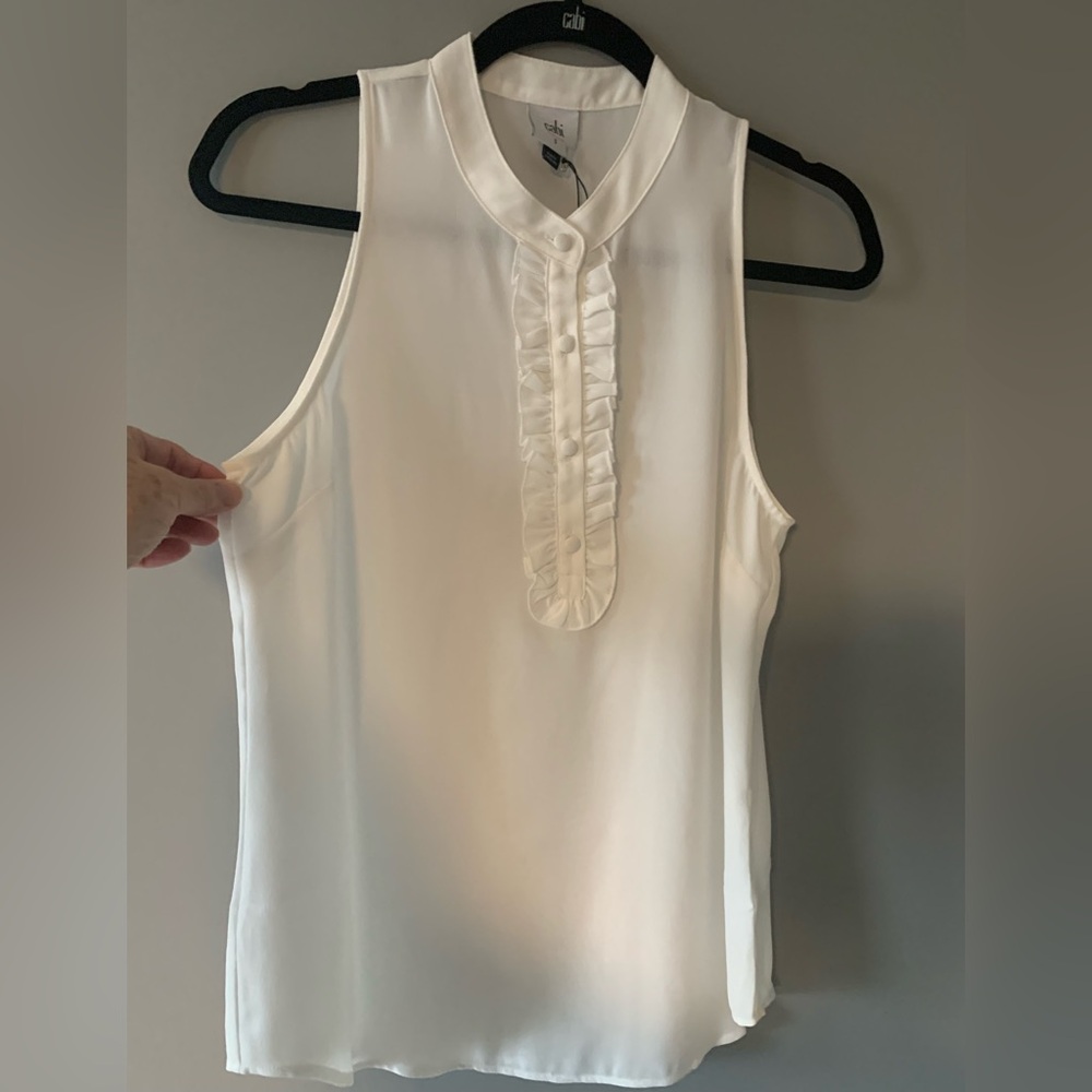 ☀️SALE☀️Cabi Tuxedo inspired white sleeveless blouse w/ ruffle placket, buttons.